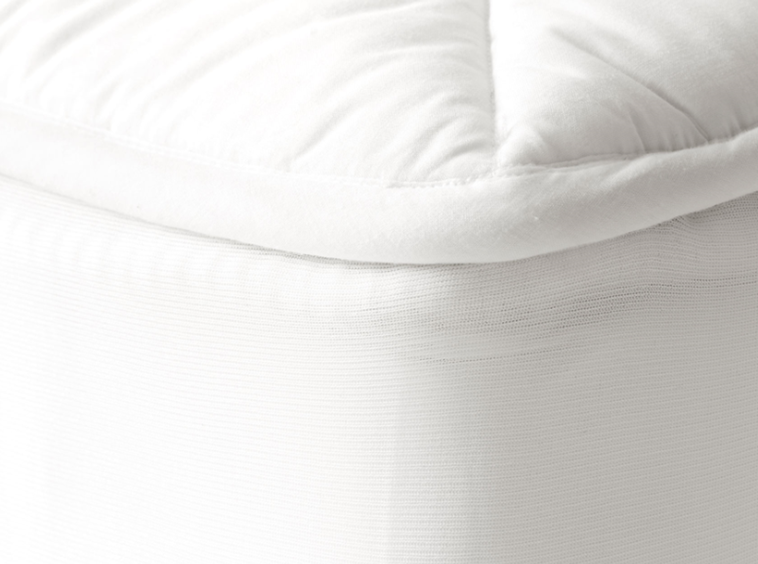 mattress protector on corner of bed