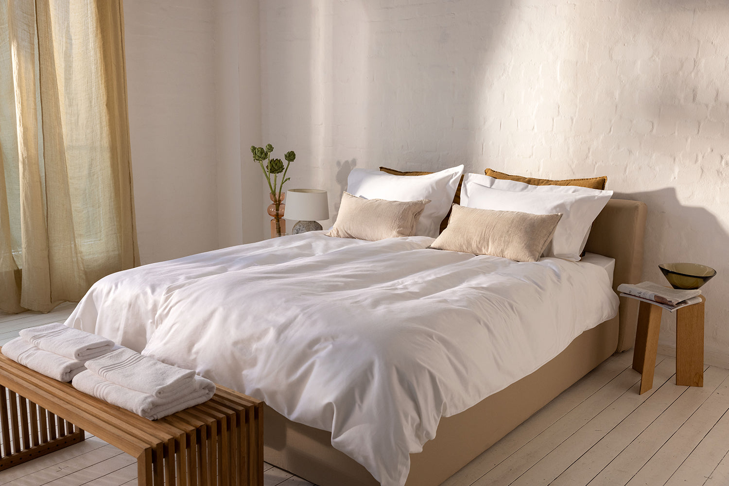 neutral bed made with natural duvet and pillows